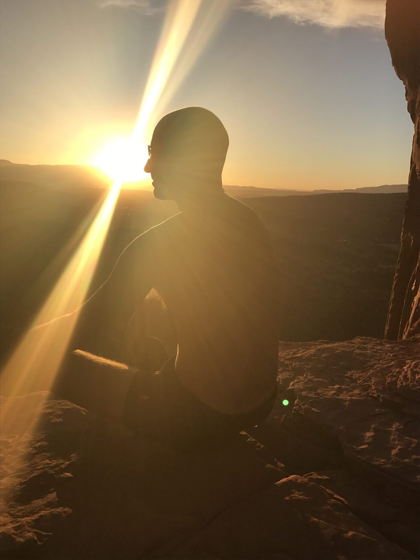 Daniel Harner in silent meditation at Sedona sunset — psycho-spiritual mentor and depth psychologist